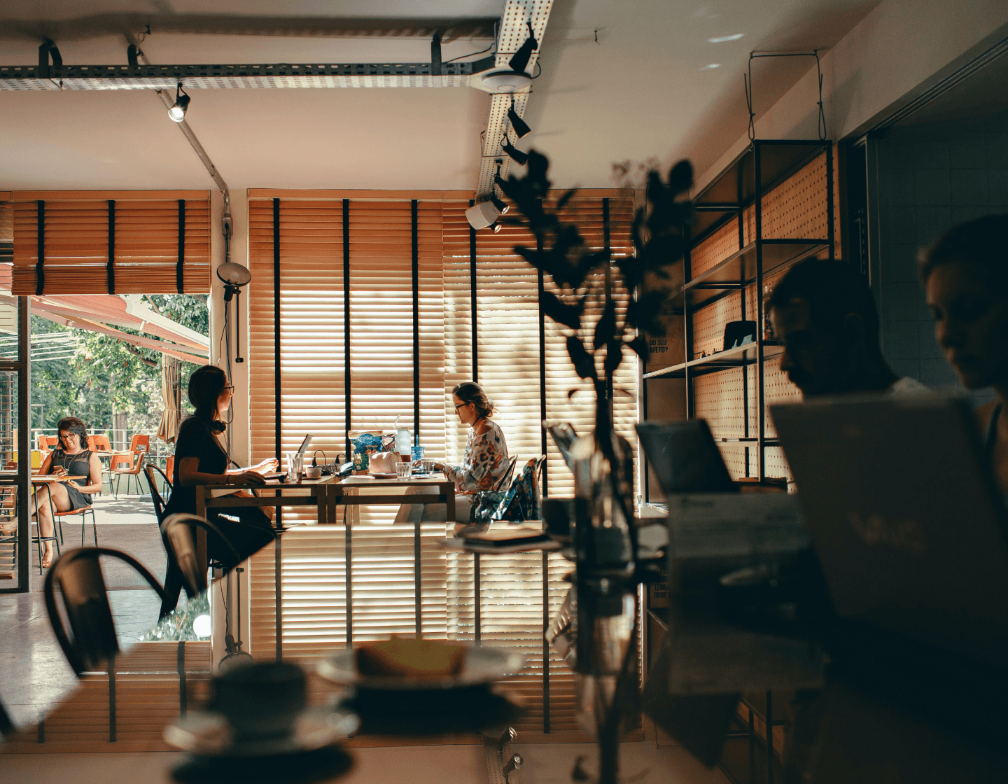 A group of individuals seated around a table embodying Spiky’s company values of understanding, care, and respect for our clients and customers.